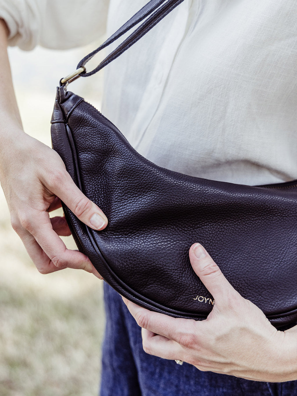 Black Leather Moon Sling Bag